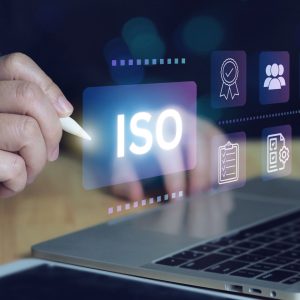 ISO certification and quality management concept. Business professional reviewing ISO certification standards with digital icons representing quality control