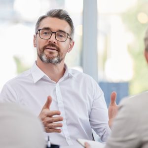 Business meeting, advice and man, accountant or manager b2b planning, client talking or finance consulting. Helping, support or advice of financial advisor, accounting ceo or senior person interview.